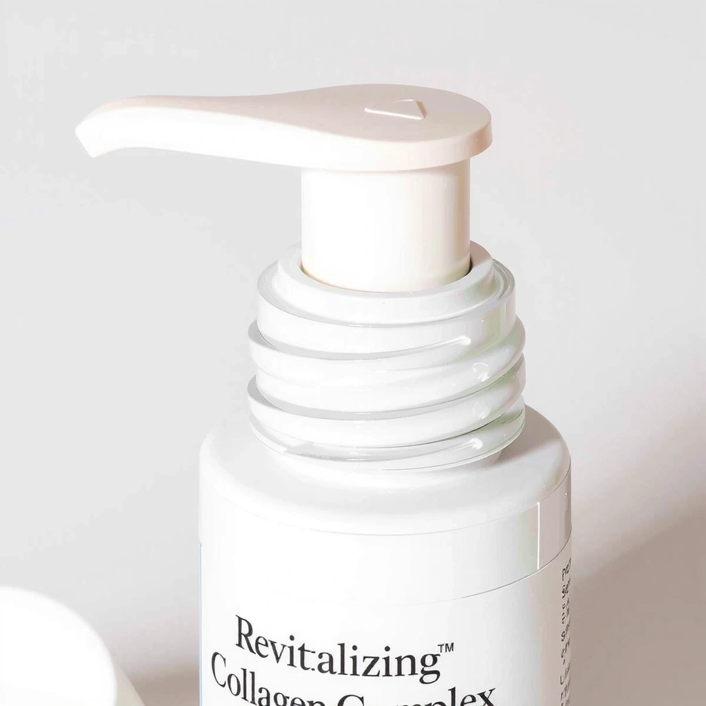 Close-up of the cap and dispenser mechanism of the Revitalizing Collagen Complex bottle, showing fine details.